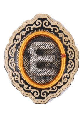 China E Alphabet Embroidered Iron On Patches Oval Embroidered School Badges for sale