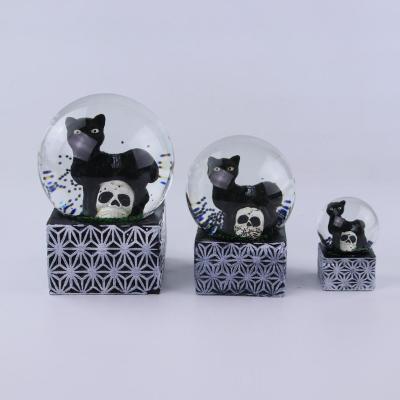 China Resin Glass Snow Globe With Black Cat For Halloween Decoration for sale