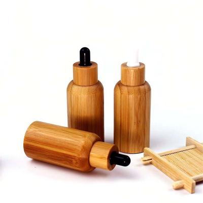 China Custom Clear Empty Wooden Cosmetic Jar Cap Household Products Skin Care Products Lotion Bottle Glass Bottle for sale