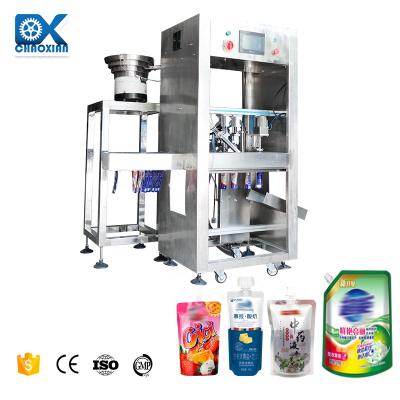 China Automatic Rotary Stand-Up Spout Bag Chemical Liquid Milk Premade Pouch Filling Packaging Machines à venda