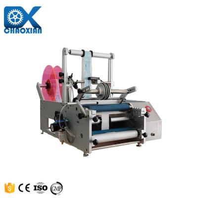 Κίνα Semi Automatic Yarn Wine Bottle Sticker Vertical Round Tuna Tube Labeling Machine Tincture Tin Can Labeling Machine προς πώληση