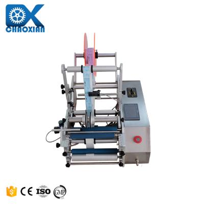 China Semi Automatic 2 Side Adhesive Sticker Bottle Labeling Machine Aerosol Can Alcohol 50Ml 30Ml 10Ml à venda