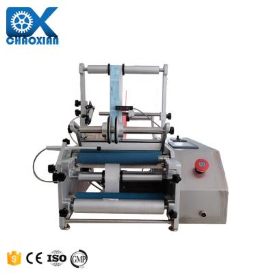 China Top Tube Label Applicator Two Corner Tri Roller Trigger Spray Semi Automatic Labeling Machine Glass Labeling Machine for sale