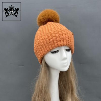 China COMMON Wholesale Fashion Buckle Adult Leather Acrylic Knit Hat Caps Winter Beanie Cap With Pom for sale