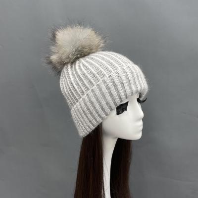 China COMMON Outdoor Warm Female Angora Knitted Raccoon Fur Pom Pom Beanie Hats for sale