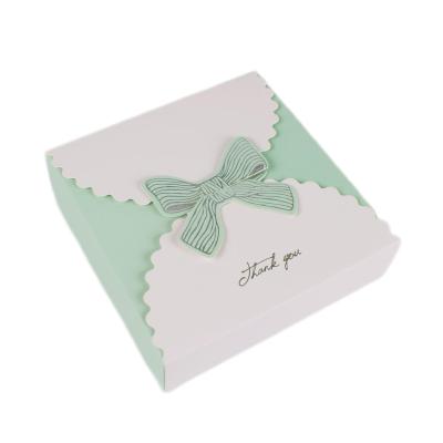 China Recycled Materials White Cardboard Bow Gift Bronzing Color Box Candy Gift Jewelry Folding Cardboard for sale