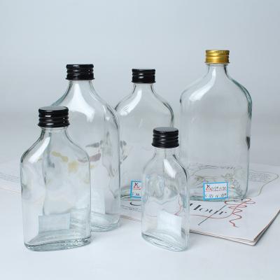 China Eco-Friendly Round 250ml 350ml 500ml Clear Empty Glass Juice Bottles Disposable Drinking Water Bottles With Cover for sale