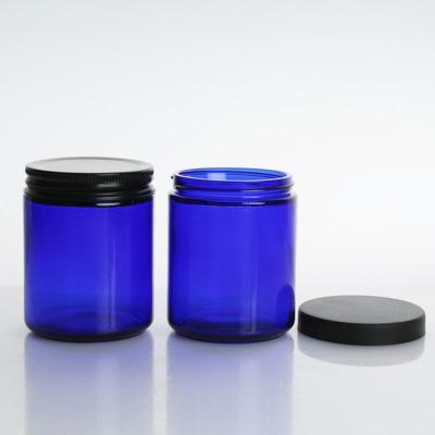 China Glass jar for facial cleanser in stock skin care cream jar blue color glass cream bottle cream jar with lid for sale