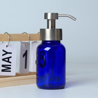 China Eco Friendly Customized 250ml Glass Soap Dispenser Blue Foaming Bottle With Stainless Steel Pump for sale