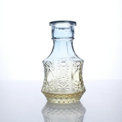 China Eco-Friendly Hot Selling Mini Decorative Glass Bottles Small Transparent Clear Vases Embossed Flower Vase Set For Home Decor for sale