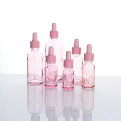 China Glass Bottles For Oil High Quality Customized Pink Color Glass Bottle For Essential Oil 5ml 10ml 20ml 30ml 50ml 100ml for sale