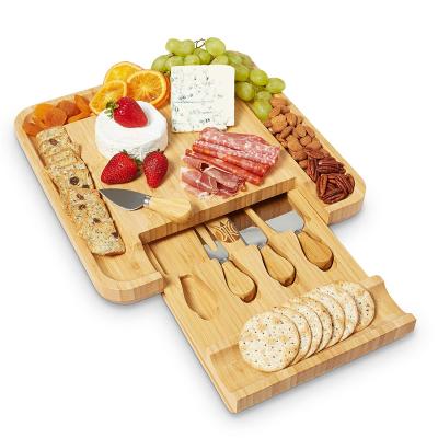 China Sustainable Serving Tray With Stainless Steel Cutters In Drawer Bamboo Cheese Board Set for sale