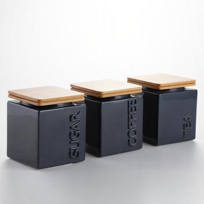 China Modern Black Ceramic Sugar Coffee Storage Jar Cube Tea Canister With Bamboo Lids for sale