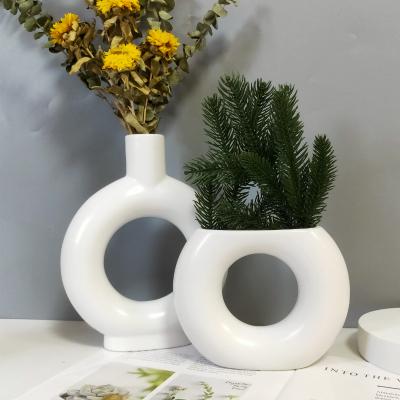 China Nordic Cavity Ring Donut Flower Elegant Modern Home Decoration Accessories White Table Vase for sale