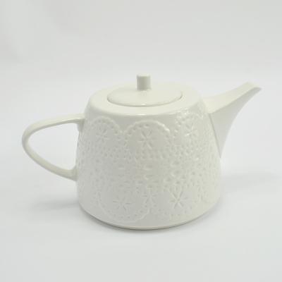 China Best Sustainable Products Selling Elegant Flower Pattern Embossed White Porcelain Teapot for sale