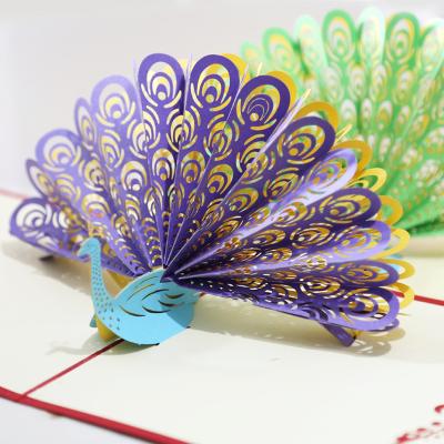 China Cheap Purple Peacock Open Folk Hotel and Resort Price Greeting Card Paper Carving Art Stereo Postcard 3D Holiday Greeting Card for sale