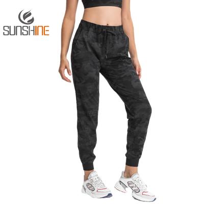 China OEM Breathable Custom Women Logo Frosted Yoga Pants For Loosen Running Fitness Pants Slimming Feet Sweatpants for sale