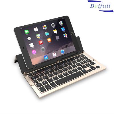 China BT Flexible Triple Folding Alloy Folding Wireless Keyboard With Phone Holder for sale