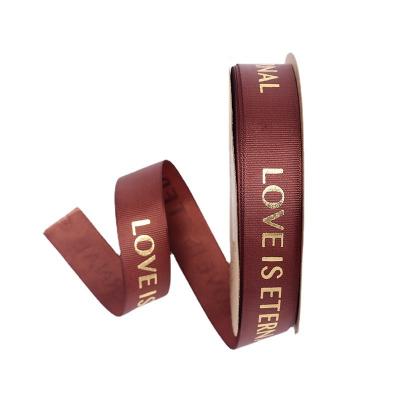 China Viable flowers wrap ribbed tan ribbon love is eternal floral bouquet materials wholesale ribbon yarn satin ribbon for sale