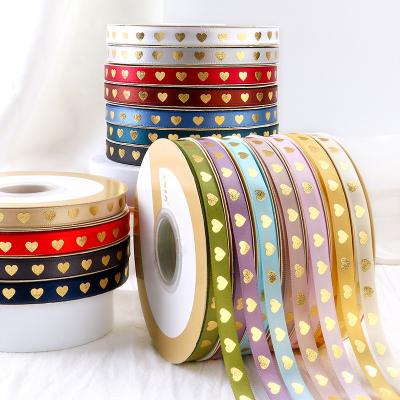 China Heart Decoration Ribbon Gift Box Flower Wrapping Ribbon DIY Bouquet Decoration Viable Grosgrain Bronzing Material Ribbon 1cm for sale