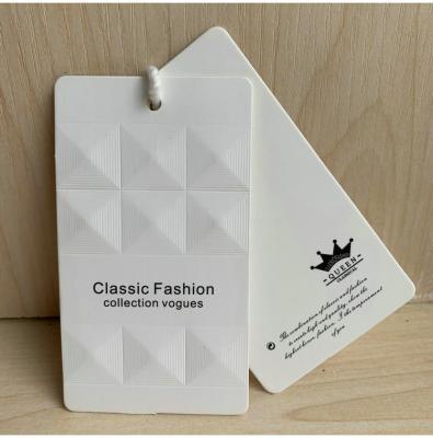 China Viable Custom Embossed Logo Design Printing Logo Paper Garment Hangtag Labels Name Apparel Hang Tags With String for sale