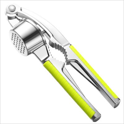 China Sustainable Multifunctional Stainless Steel Garlic Press Kitchen Instrument for sale