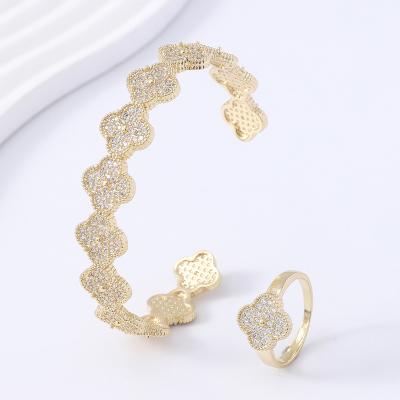 China 2023 High Quality Women Fashion Jewelry Set Inlaid Four Leaf Flower With Zircon Ring Bangle Set Gold Plating Charm Bracelet For Xin Ting for sale