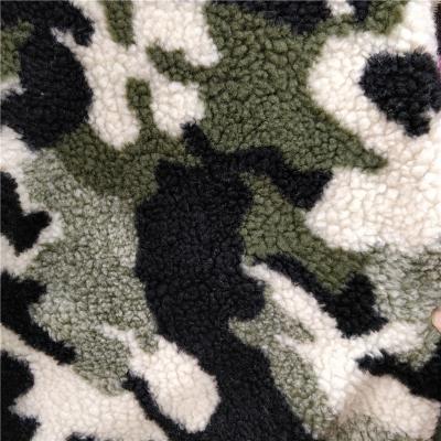 China 100% Polyester Jacquard Printed Camouflage Color Sherpa Lamb Fur Fleece Fabric for sale