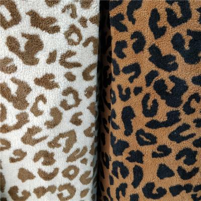 China Toy Jacquard Leopard Faux Faux Sheep Lamb Fur Fabric For Garment for sale