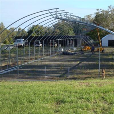 China Vegetable Tropical Dientes Invernadero Sierra are low cost single tropical cross top span plastic sheet sawtooth greenhouse for sale