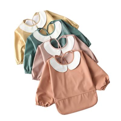 China Washable Girl Waterproof Kids Baby Stuff Chest Protection Feeding Bibs Eating Apron Pu Baby Bib Smock Full Sleeve for sale