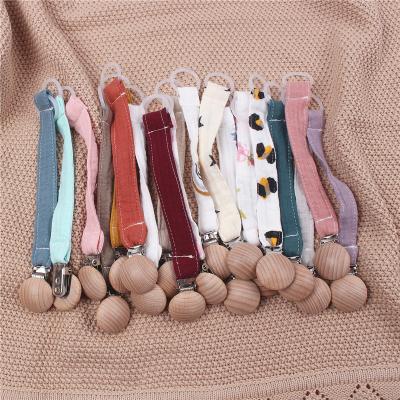 China New Design Baby BPA Free 100% Metal Clip Cotton Ribbon Baby Cloth Wooden Pacifier Dummy Chain 100% Feeding Chain for sale