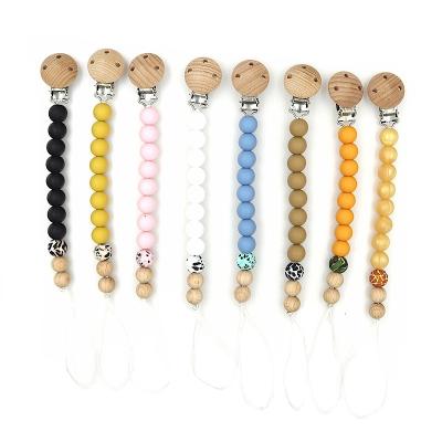 China Soft Chain Toy Dummy Clips Baby Pacifier Silicone Beads Teething Wooden Toys Soother Pacifier Holder Clip for sale