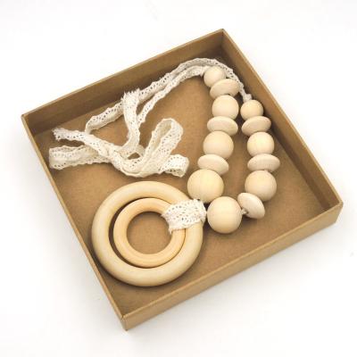 China Toy Dropshipping Plain Maple Soft Wooden Teether Ring Unfinished Round Beads Safe Wooden Necklace for sale