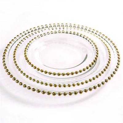 China Sustainable Wholesale Unbreakable Transparent Glass Decoration Dish With Pearls Gold Rim for sale