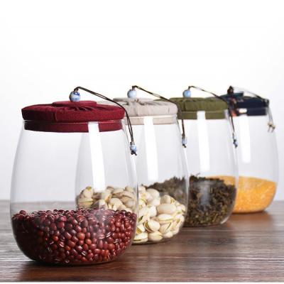 China Food Storage Container Heatable Transparent Glass Jar For With Cloth Cover for sale