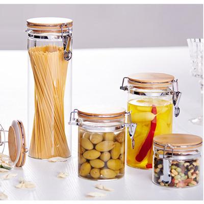 China Home Bar Hotel Restaurant Food Jar Glass Airtight Round Glass Storage Canister Glass Pasta Container With Metal Lock Wooden Lid for sale