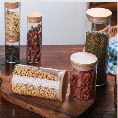 China Storage Heatable Glass Jar With Sealed Bamboo Lids Clear Bulk Glass Food Storage Canister For Food for sale