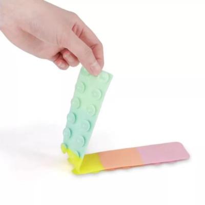 China 2022 New Factory Cheap Eco-friendly Decompression Decompression Touchless Squid Sucker Silicone Sheet Wiggling Toys Squidopop For Kids Adult for sale