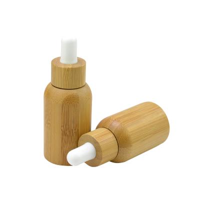 China Custom Personal Care Logo Bamboo 100ML Essential Oil Spray Bottle Glass 30ML Dropper For Essential Oil Packaging for sale