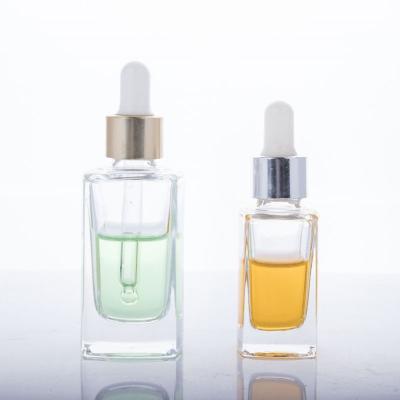 China Cosmetic Most Popular 15ml 30ml Essential Oil Clear Glass Dropper Bottles With Gold Foil Cap for sale