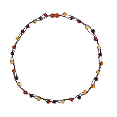 China FASHIONABLE Amber Necklace Irregular Amber Multi Super Natural Treasure Woven Hand Knot Necklace Bracelet Set for sale