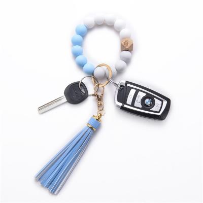 China 2021 punks the new hot silicone bead key chain bracelet wooden pendant beads key chain bracelet optional 18 colors for sale