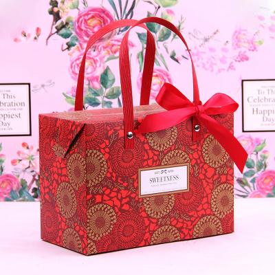 China Handmade Custom Logo Printed Handheld Wedding Luxury Paper Gift Bags With Handles for sale