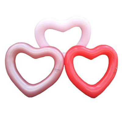 China Water Fun Sets Swimming Pool Eco-friendly PVC Swim Ring Heart Shape Inflatable Swim Ring For Sale for sale