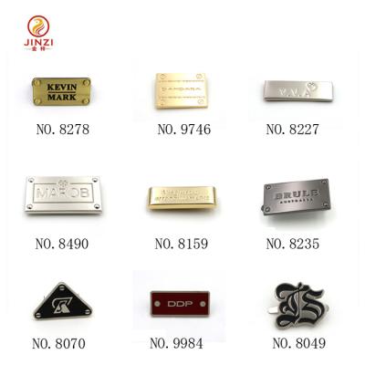 China High quality with factory price custom metal logo plate, metal letter logo, metal labels and tags for handbags for sale