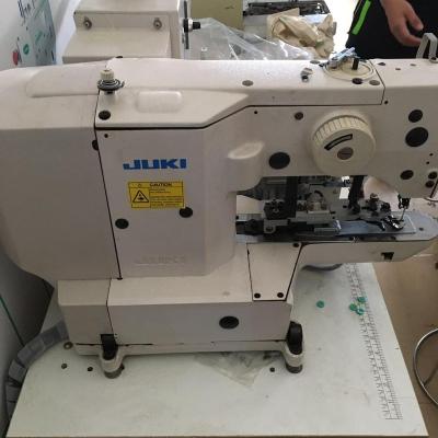 China Garment Shops Used Juki-1903A Automated Button Tying With Automatic Button Sending Sewing Machine for sale