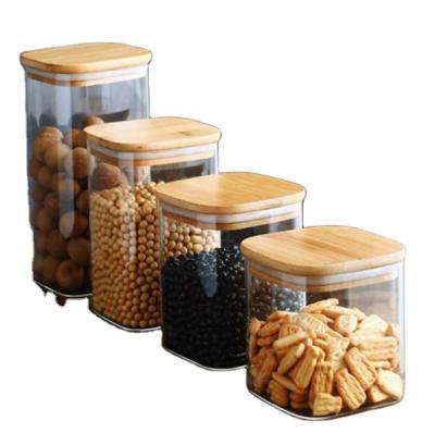 China Glass Food Square Jar With Lids Airtight Bamboo Wooden Borosilicate Glass Food Container Clear Serving For Tea Nuts Spice Candy for sale