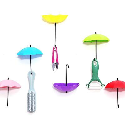 China Sustainable New and Fashion Umbrella Form Wall Hook Kitchen Sticky Hook Home Decorative Adhesive Hook for sale