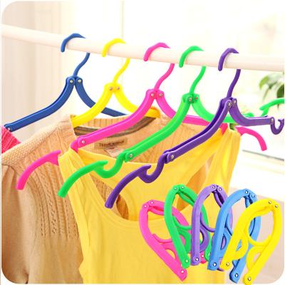 China Multifunctional cheap plastic portable travel folding hanger travel folding hanger for sale